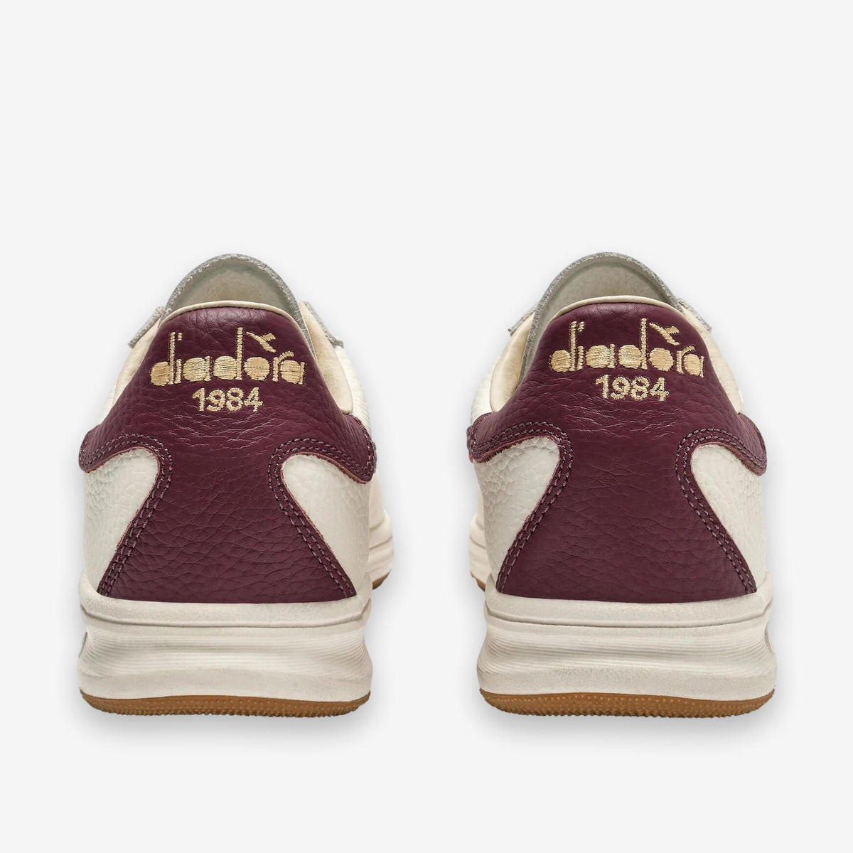 B. Elite Dominio Heritage White/Violet