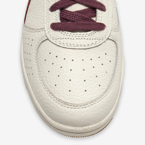 B. Elite Dominio Heritage White/Violet
