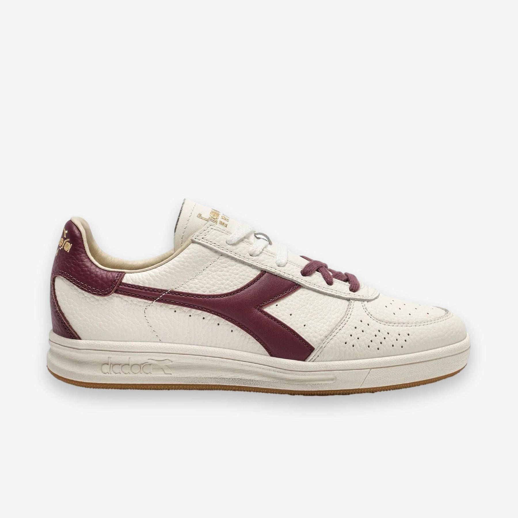 B. Elite Dominio Heritage White/Violet