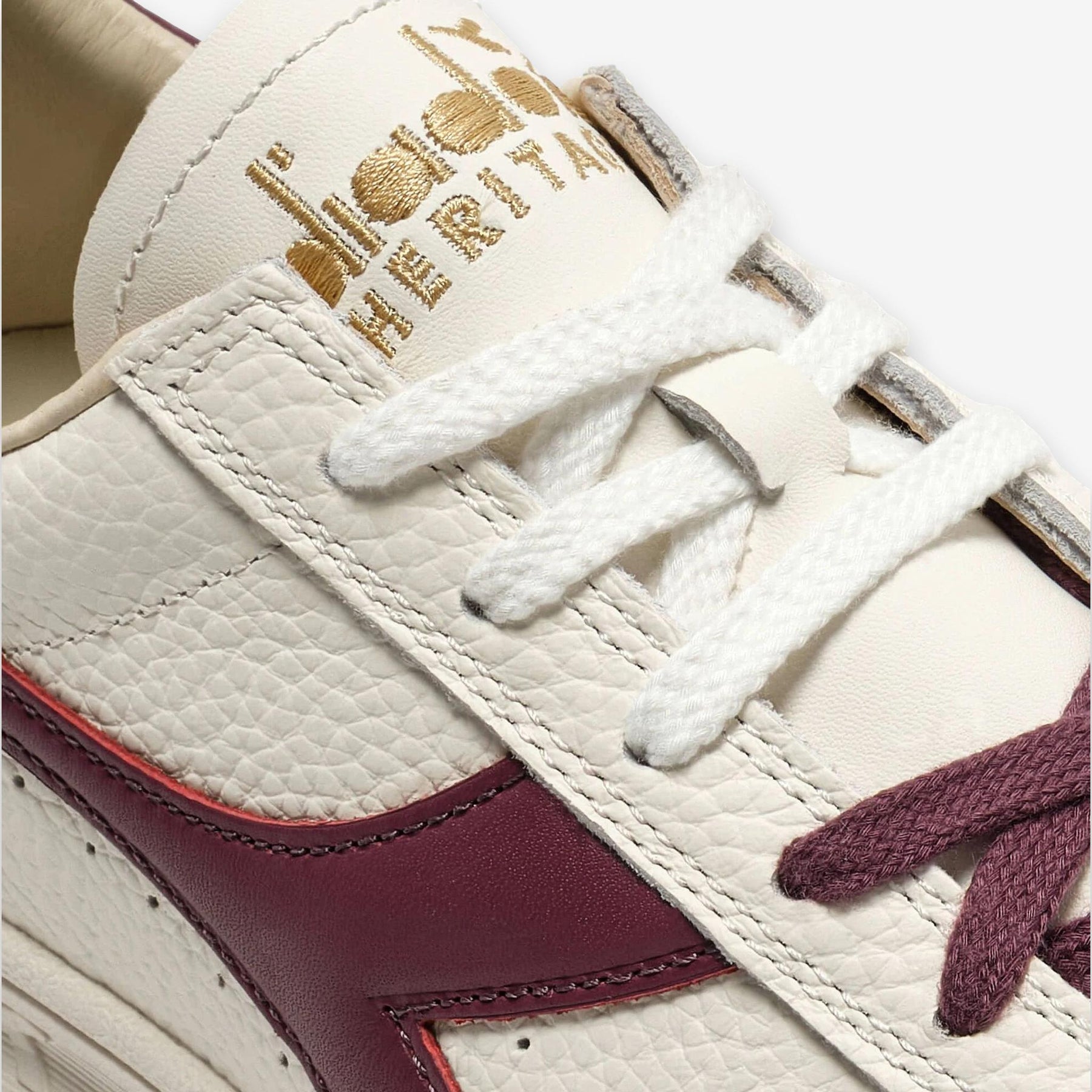 B. Elite Dominio Heritage White/Violet