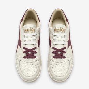 B. Elite Dominio Heritage White/Violet