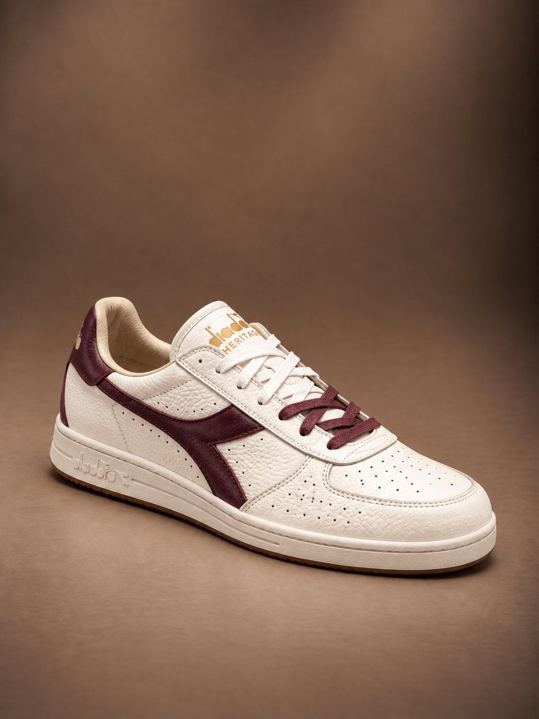 B. Elite Dominio Heritage White/Violet